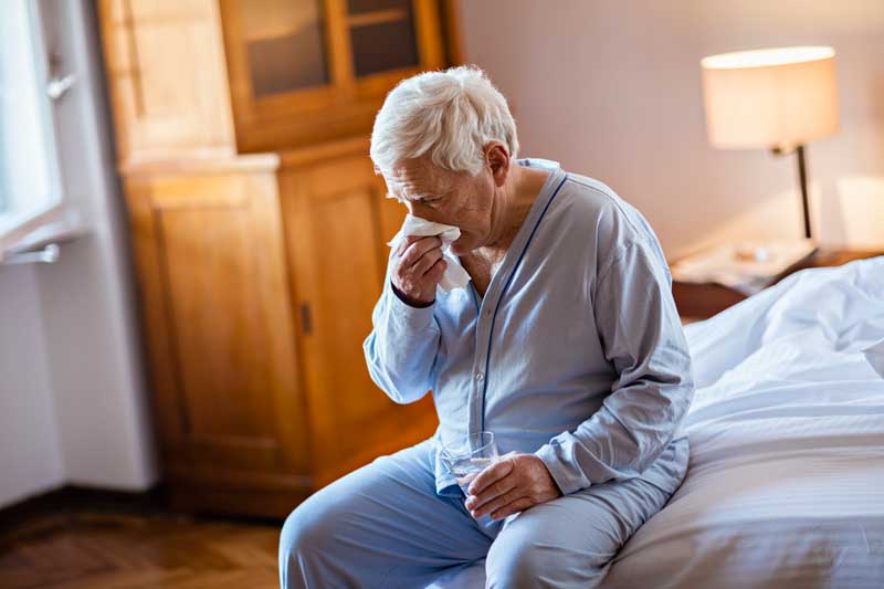 Man Blowing Nose