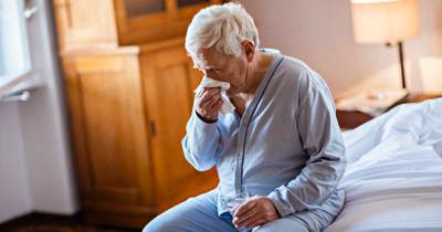 Man Blowing Nose