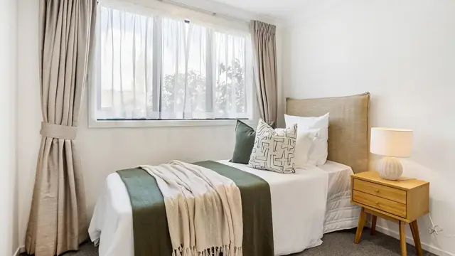 Cashmere View - Apartment 306 - bedroom with single bed and side table 