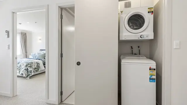 New Lynn apartment bedroom and laundry