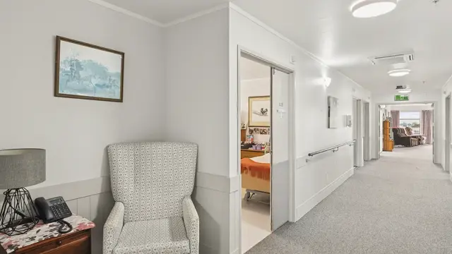 The Gardens Care Home - hallway looking into lounge 