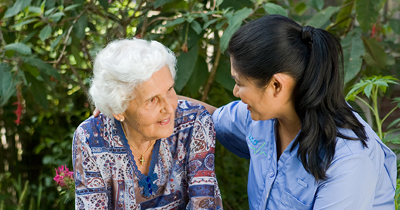 Bupa resident in the garden with carer