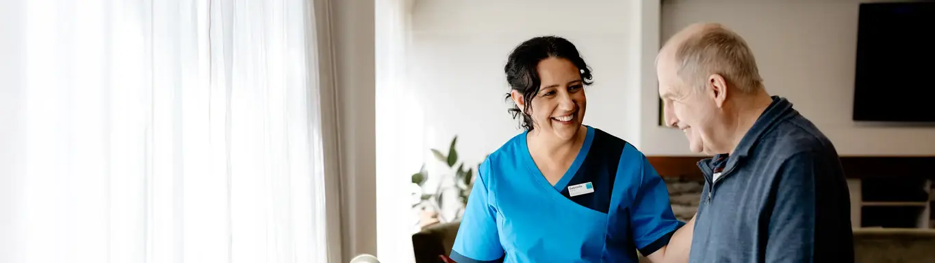 Hospital resident with Bupa staff member