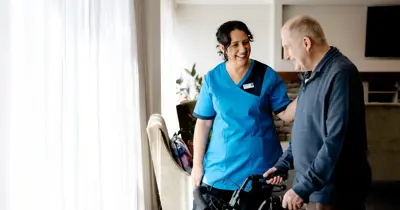 Hospital resident with Bupa staff member