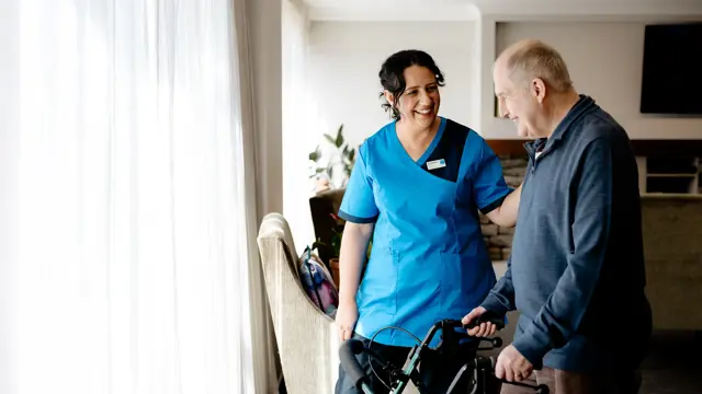 Hospital resident with Bupa staff member