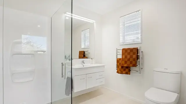 Villa 40 - bathroom with shower, sink and toilet 