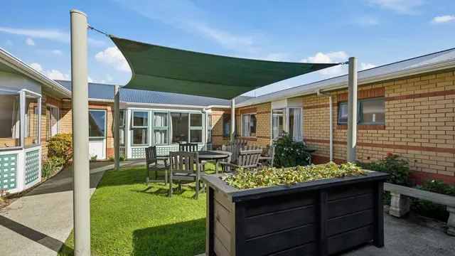 Bupa Winara Care Home - outdoor seating and raised gardens 