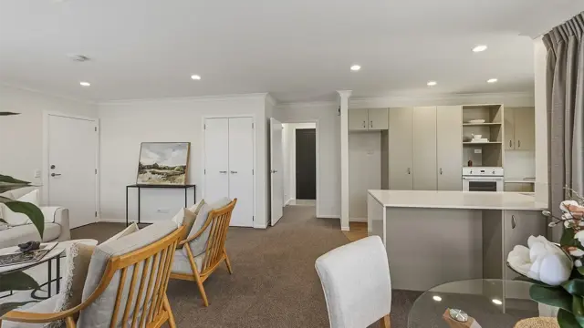 Redwood villa 33 - couch and dining table looking into kitchen 