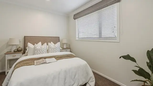 Redwood villa 33 - bedroom with bed and side tables 
