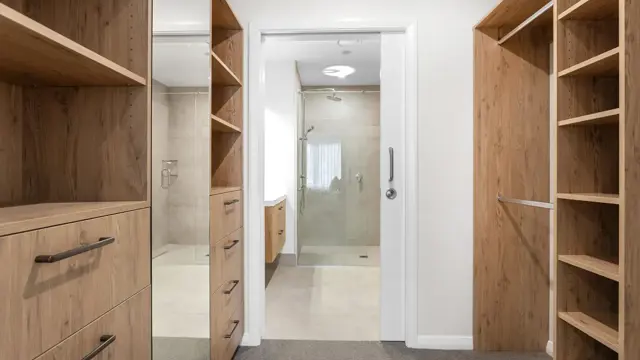 Rakahui Apt - walk in wardrobe and bathroom 