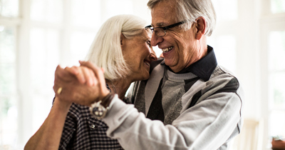 Retired couple dancing