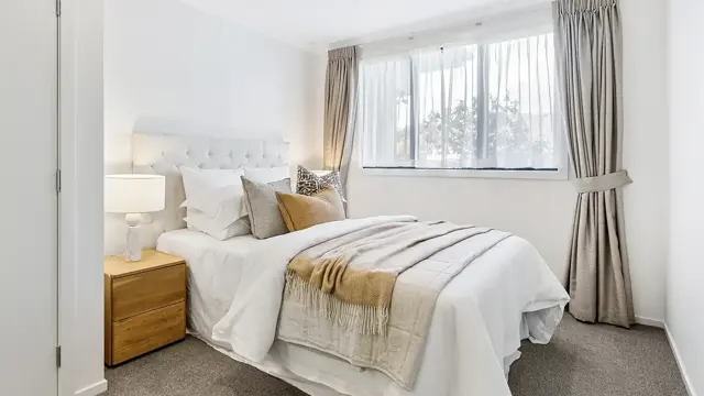 Cashmere View - Apartment 306 bedroom with bed and side table 