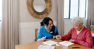 Bupa staff member with care resident activities