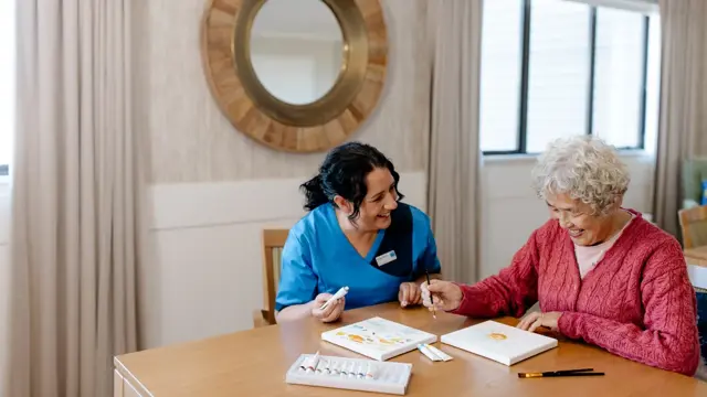 Bupa staff member with care resident activities